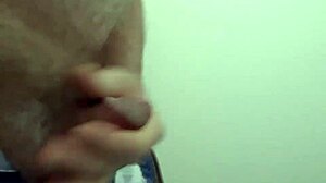 Rustyas1 masturbates solo in public toilet.