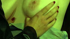 busty lesbian slave with big natural boobs tied up and intimately touched by dominant mistress in bondage