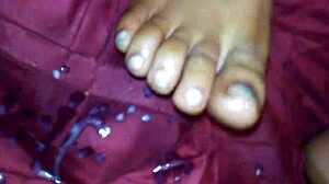 Ebony Delivers Intense Foot Job Leading To Explosive Cumshot