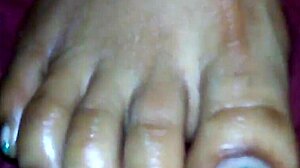 Ebony Delivers Intense Foot Job Leading To Explosive Cumshot