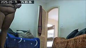 Hidden camera catches busty Brazilian BBW maid cleaning house naked, showing huge tits and ass