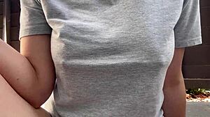 Horny Italian milf with big tits and nipples smokes outdoors in fetish close-up