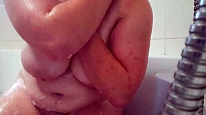 busty teen washes and massages her soapy natural breasts in homemade video