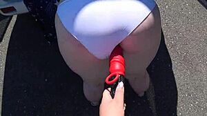 girlfriend straps on dildo to fuck mature milf with fat big ass and saggy tits outdoors near car in pov