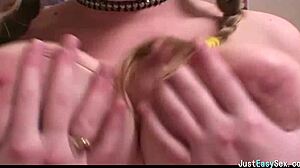 Pigtailed Brunette Gently Plays with Her Big Tits