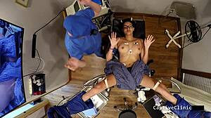 Rebel Wyatt gets captured by government agents who slap her pierced nipples and spread her hairy pussy in latex humiliation.