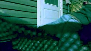 Skinny amateur stretches in leggings at night, creating intriguing lattice shadows on ass and legs during homemade workout.