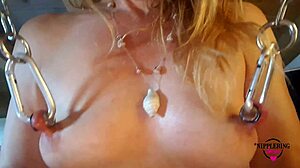 i'm this kinky mom rubbing my pierced pussy on a vibrator with nipples hooked and tied to the ceiling hard