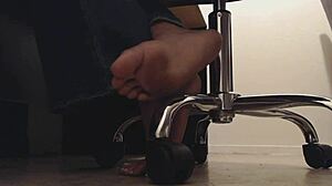 Foot voyeur sneaks peeks at tall mistress's dirty soles and crunching toes underdesk.