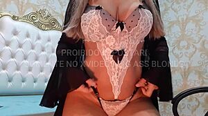 Blonde latina milf dances sensually in white and black lingerie.