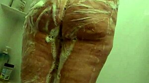 I spy on voyeur candid BBW milf getting soaking wet in shower with hidden cam