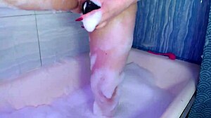 In a casual story, this pornstar emerges wet from bath without makeup. Yet she still has a dildo in her pussy as sudden work begins with solo masturbation in shower.