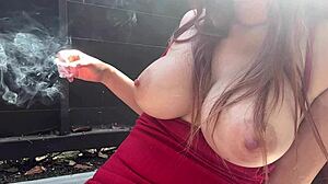 Horny Italian milf's huge boobs bounce outdoors during kinky smoking nipple play!