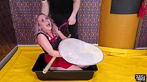 dominated bdsm slut gags bound and drenched in piss!