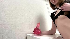 hey check this horny babe sucking her pink dildo then stretching that pussy wide