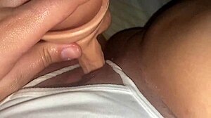 latina shoves dildo through wet panties into big pussy lips closeup