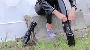 Brunette in tight leather leggings, high heels, and biker jacket dominates outdoors.