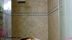 Tall brunette model strips down for steamy shower.