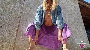 kinky mother flashes pierced nipples and plays outdoors in see-through tease