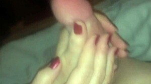 i'm givin my wife a handjob on her monster cock... oops spilled it