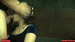 bound sub chokes on rough throatfuck from dom